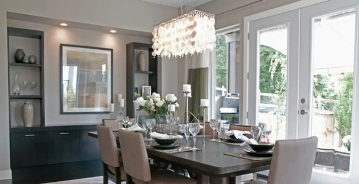 Elegant dining room chandelier installation above table in Myrtle Beach, SC