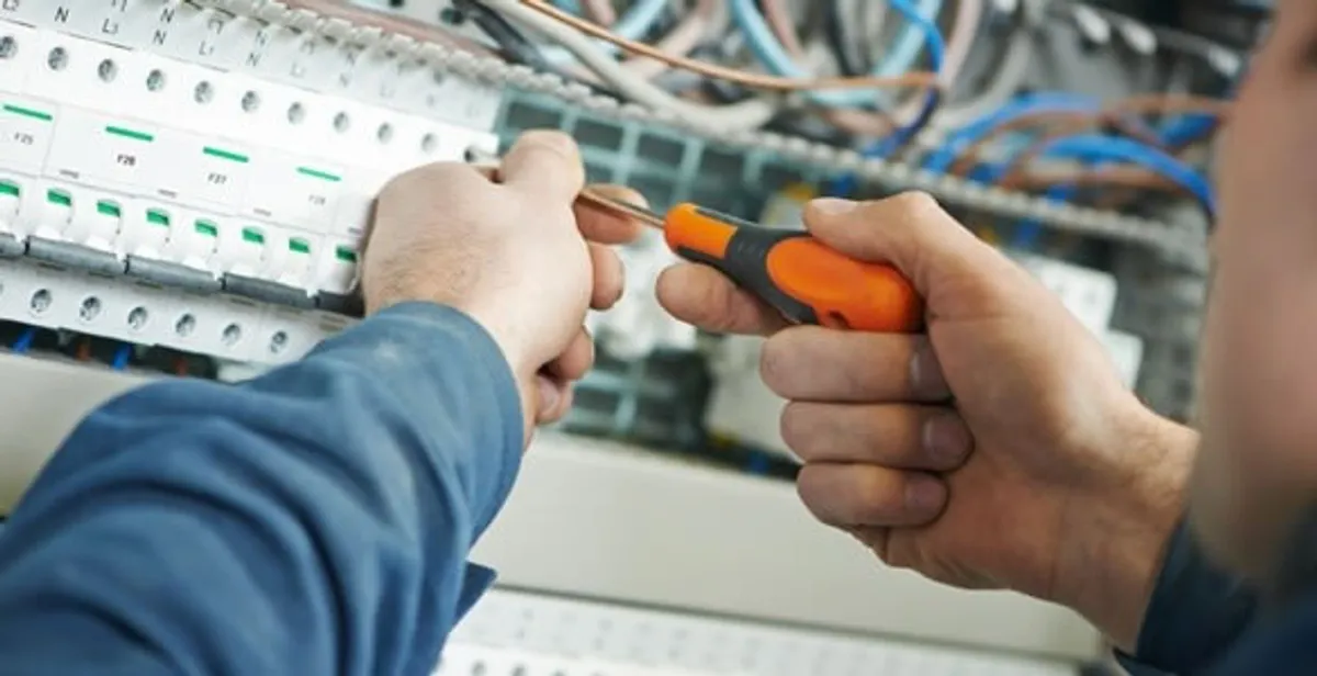 electrical service showing licensed electrician performing electrical panel maintenance and adjustments in Myrtle Beach, SC