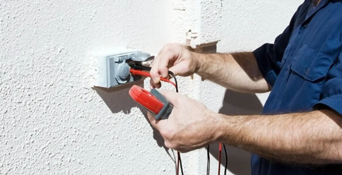 Electrician performing home electrical outlet and wiring inspection in Myrtle Beach, SC