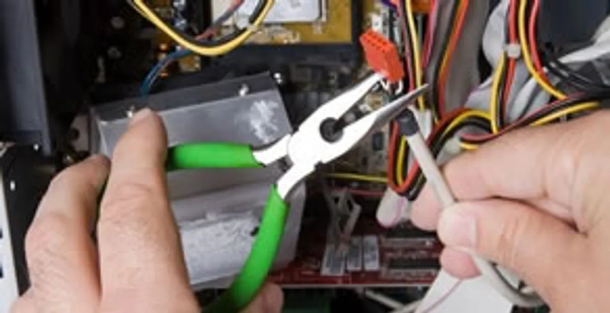 Licensed electrical contractor performing electrical repair with tools in North Myrtle Beach, SC