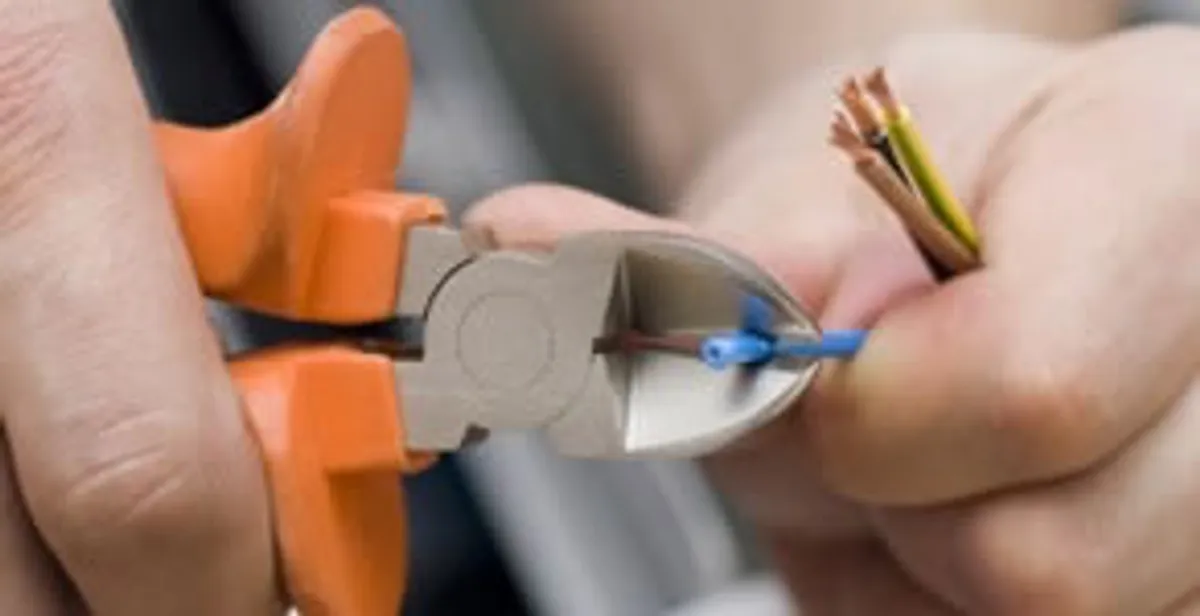 professional electrical services showing precise wire cutting by licensed electricians in Myrtle Beach, SC